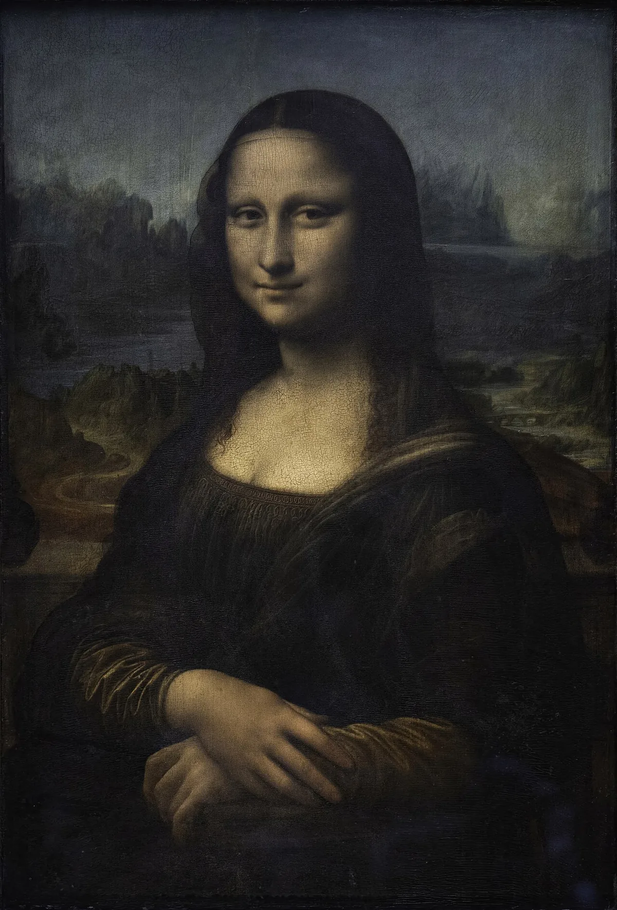 Foule de visiteurs photographiant la Joconde dans la salle des États du musée du Louvre
