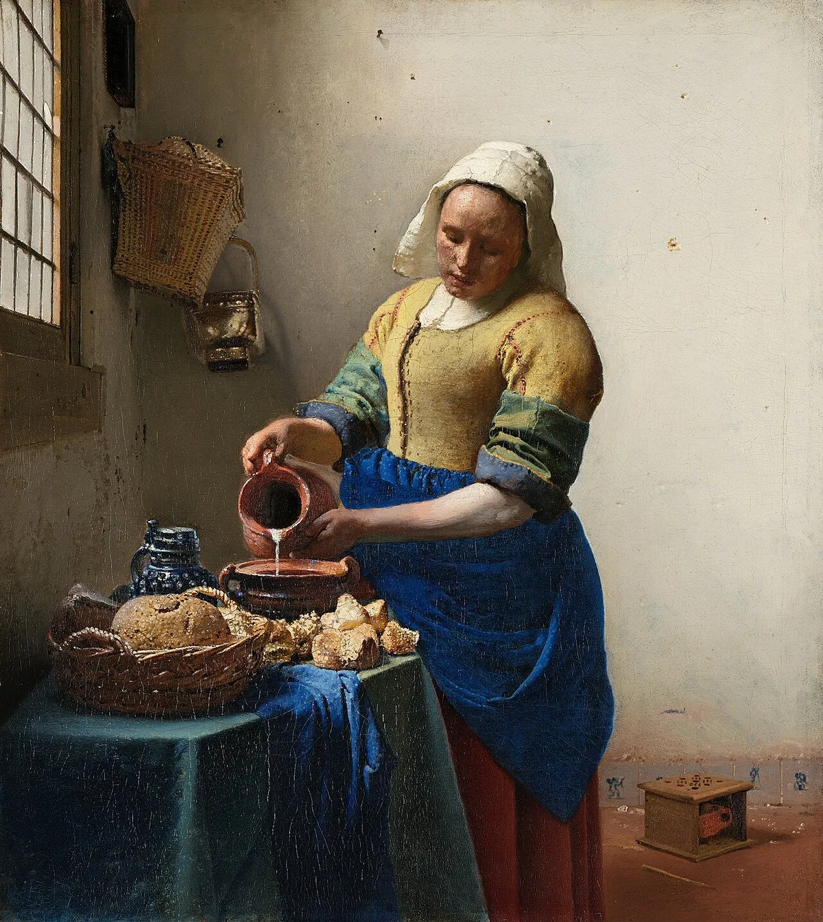 La Laitière de Vermeer versant du lait, autre œuvre iconique du peintre conservée au Rijksmuseum d'Amsterdam