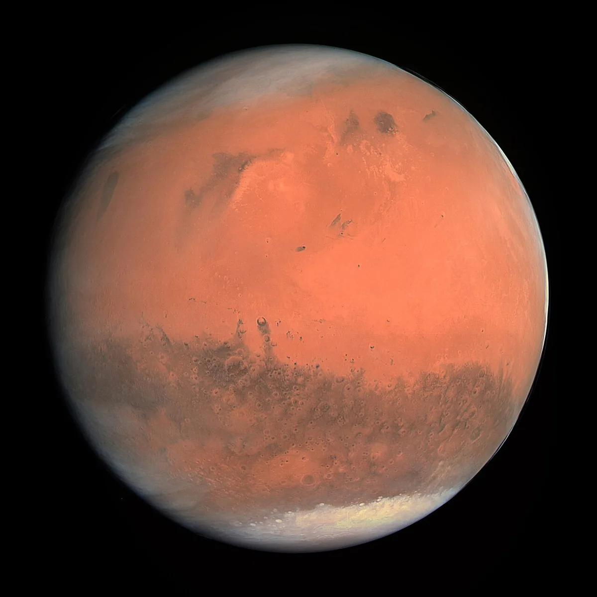 Photographie de la planète Mars en vraies couleurs, disque rouge orangé avec calotte polaire, prise par la sonde Rosetta